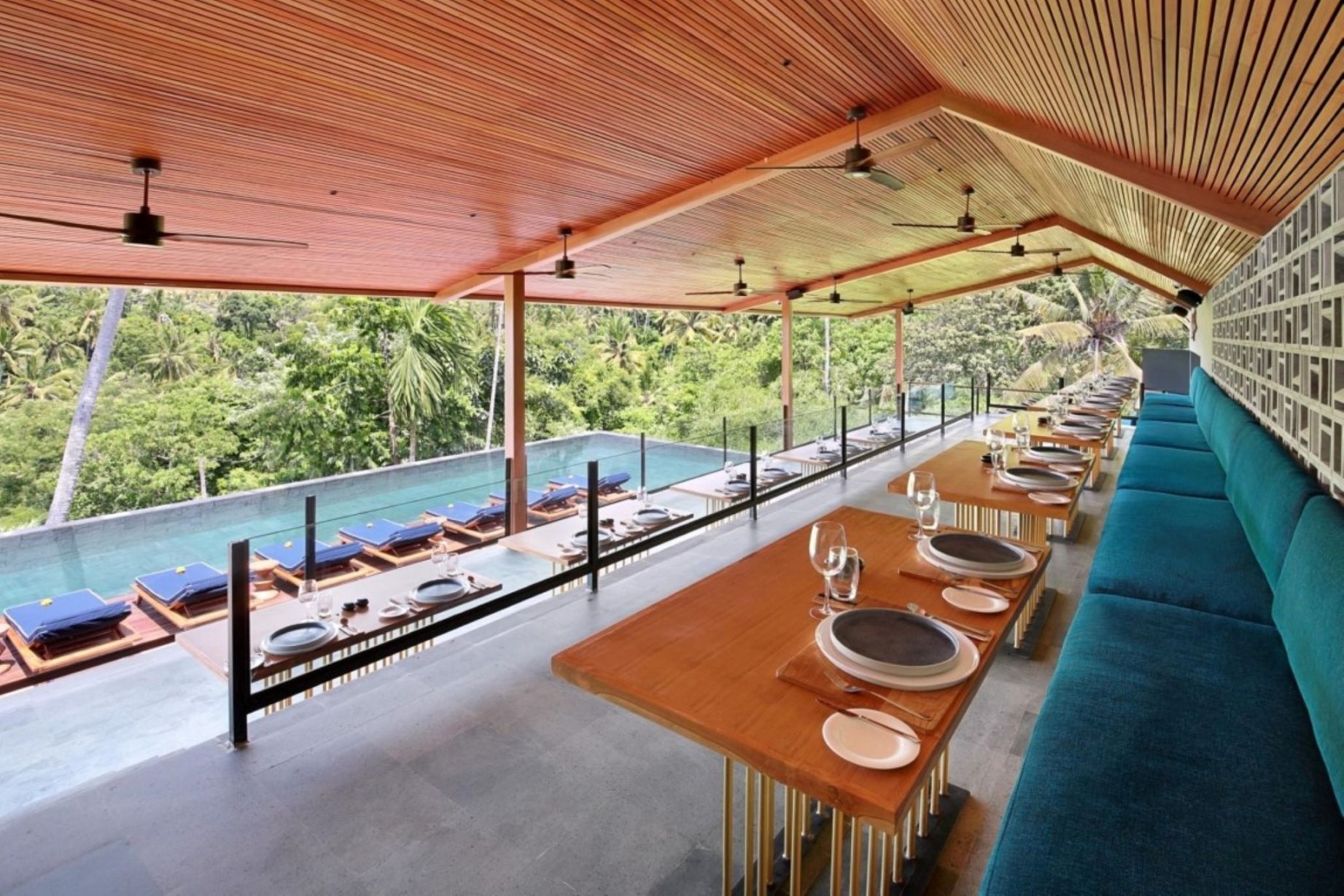 Relax in the serene ambiance of Wild Air Restaurant where lush green valleys frame your dining experience blending Asian and Western flavors for an unforgettable culinary escape.