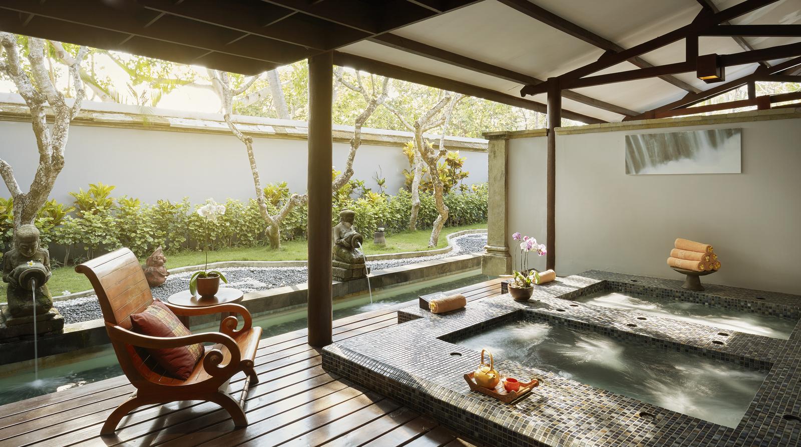 A serene retreat awaits at YHI Spa where gentle sounds of nature blend with luxurious treatments creating a perfect setting for relaxation and renewal in Bali's tranquil environment.