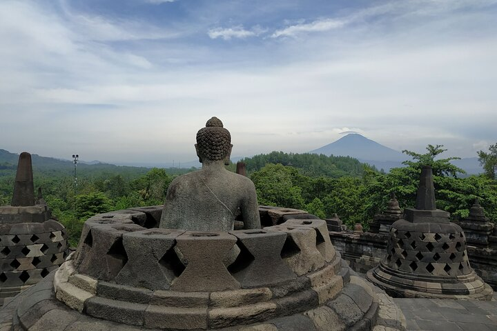 Experience the majestic beauty of Borobudur Temple where ancient stone carvings meet serene landscapes offering a glimpse into Indonesia’s rich cultural heritage and spiritual traditions.
