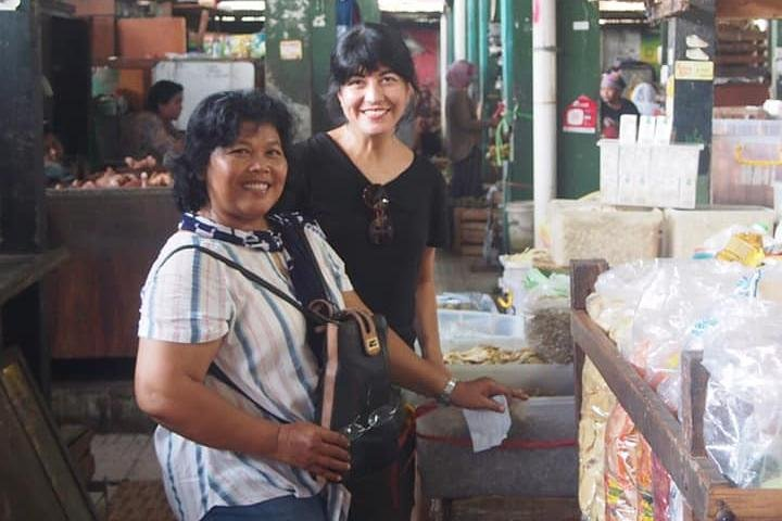 Immerse yourself in local culture as you explore the market with ibu Herni selecting fresh ingredients and learning about traditional herbs for your Javanese cooking adventure in Yogyakarta.
