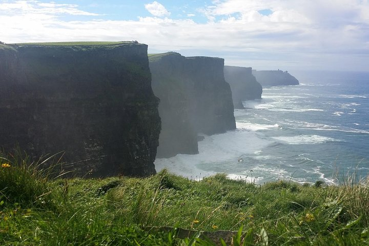 Discover the breathtaking Cliffs of Moher where towering cliffs meet the roaring Atlantic ocean offering a unique perspective and unforgettable memories along Ireland's stunning coastline.
