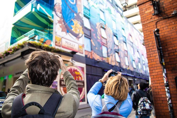 Explore Dublin's hidden gems as you stroll through its streets capturing unique art pieces and learning about the stories behind each mural from your knowledgeable guide.