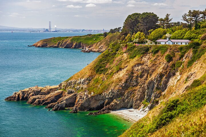 Experience breathtaking views of rugged cliffs and tranquil waters on the Howth Coastal Half-Day Bus Tour where you can explore a picturesque fishing village and delight in delicious seafood.