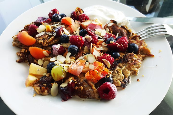 Experience a delightful fusion of flavors in a modern setting savoring chef-inspired dishes while enjoying stunning sea views and engaging stories from your host Elena.