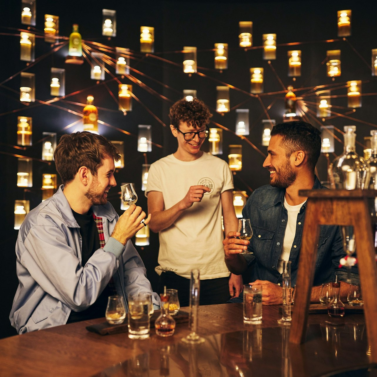 Engage in a delightful exploration of flavors at Roe & Co Distillery where skilled mixologists guide you through crafting personalized whiskey cocktails with friends in a unique setting.