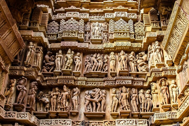 Close up of artful carved walls of Kandariya Mahadeva Temple in Khajuraho.