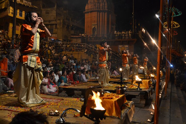 Ganga aarti ceremony rituals performed by Hindu priests at Assi Ghat in Varanasi.