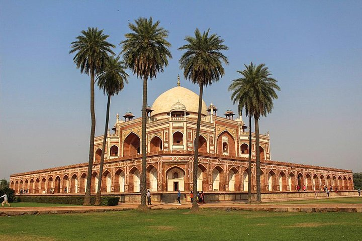 Marvel at the red sandstone structure of tomb