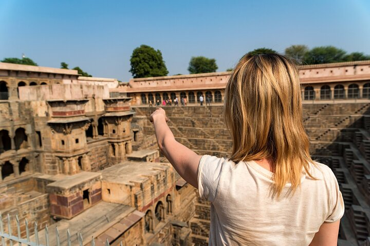 A Girl traveler marking on Chand Baori.