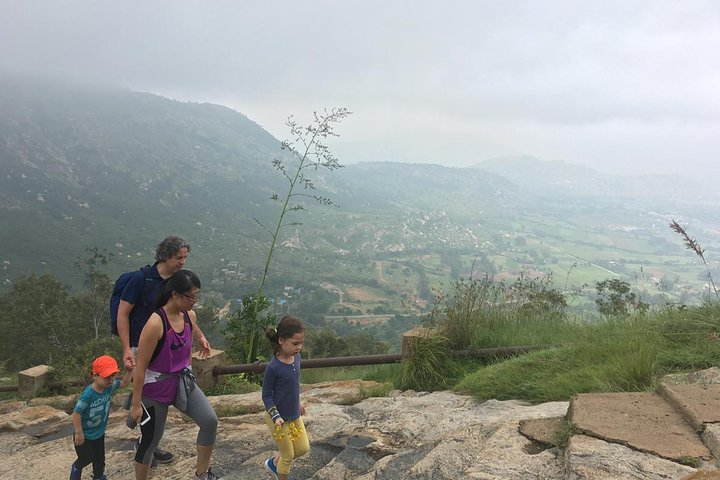 Soak in the views of the open farm lands and mist clad hills as you hike Nandi Hills.