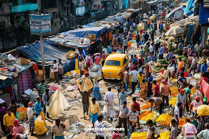 Walk around the largest flower market in India. And amongst the largest in Asia.