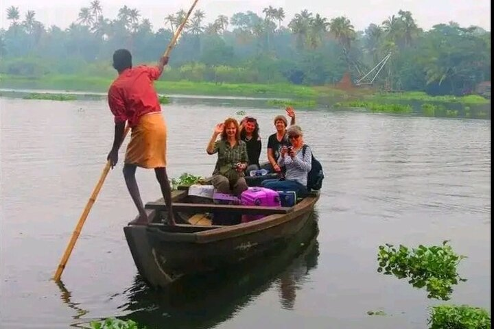 Vaikom Backwateter is unique when it come to sitting in a boat punting like this with a long Bamboo.