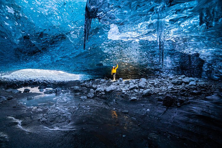 Explore the surreal beauty of crystal ice caves where stunning blue hues create a magical environment beneath Vatnajokull Glacier. An unforgettable adventure awaits those ready to venture inside!