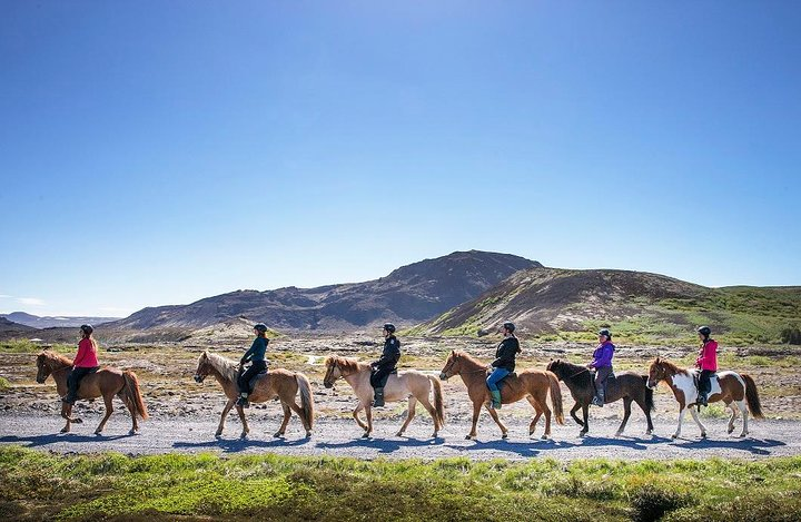 Experience the stunning beauty of Icelandic landscapes on horseback riding alongside lakes and mountains while immersing yourself in the rich history of this unique equestrian adventure.
