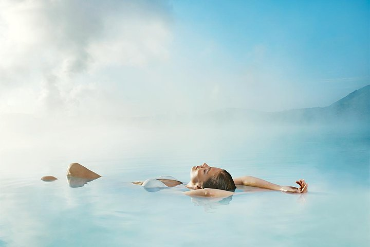 Immerse yourself in the soothing geothermal waters of the Blue Lagoon surrounded by stunning volcanic landscapes before witnessing the breathtaking dance of the Northern Lights. Capture unforgettable moments!