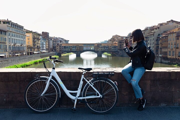 Explore Florence's hidden gems on an E-Bike cruising through picturesque streets and stopping at iconic landmarks all while enjoying the serene beauty of the Arno River.