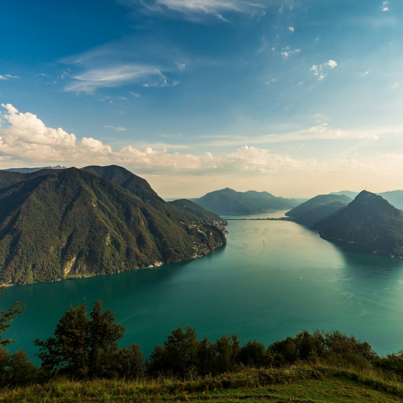 Experience the stunning lakeside views and lush mountains of Lake Como where the serenity of nature meets the charm of Italian and Swiss culture. Perfect for unforgettable memories.