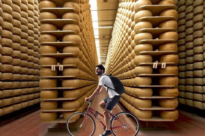 Cycling among the Parmigiano wheels