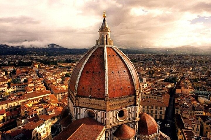 Experience breathtaking city views from the top of the Cupola marvel at Brunelleschi’s artistry and savor exquisite Tuscan wines paired with local specialties during this unforgettable Florence tour.