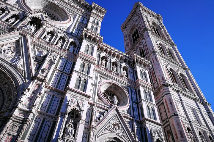 Discover the architectural marvels of Florence's Duomo Complex where intricate designs and rich history invite you to explore the Baptistery Cathedral and Giotto's Belltower.