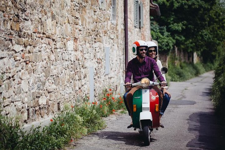 Explore the charming Tuscan countryside on a stylish Vespa winding through picturesque streets and savoring authentic Italian cuisine making unforgettable memories along the way.