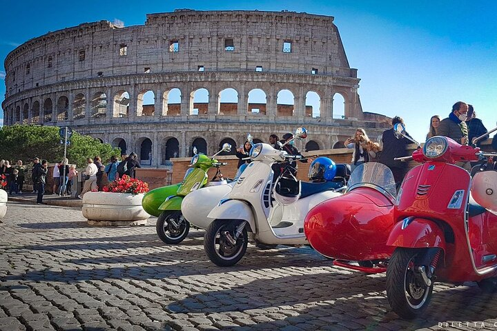 Explore the charm of Rome from a unique perspective aboard Vespa sidecars with iconic landmarks like the Colosseum as your backdrop perfect for creating unforgettable memories.