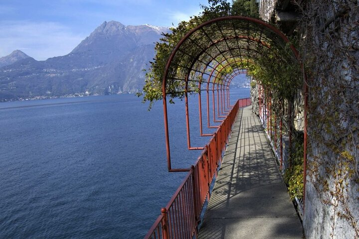 Stroll along the lakeside promenade where stunning mountain views and tranquil waters create the perfect backdrop for exploration and relaxation amidst Lake Como's scenic charm.