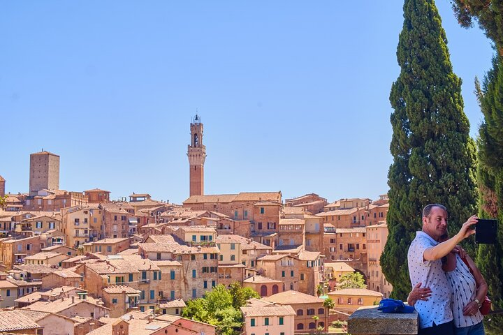 Discover the stunning skyline of Siena where history meets scenic charm. Wander through its ancient streets capturing unforgettable moments against the backdrop of iconic Gothic architecture.