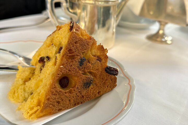 Savor a slice of Milan's history with traditional Panettone a perfect blend of culinary art and heritage inviting you to indulge in rich flavors and delightful conversations.