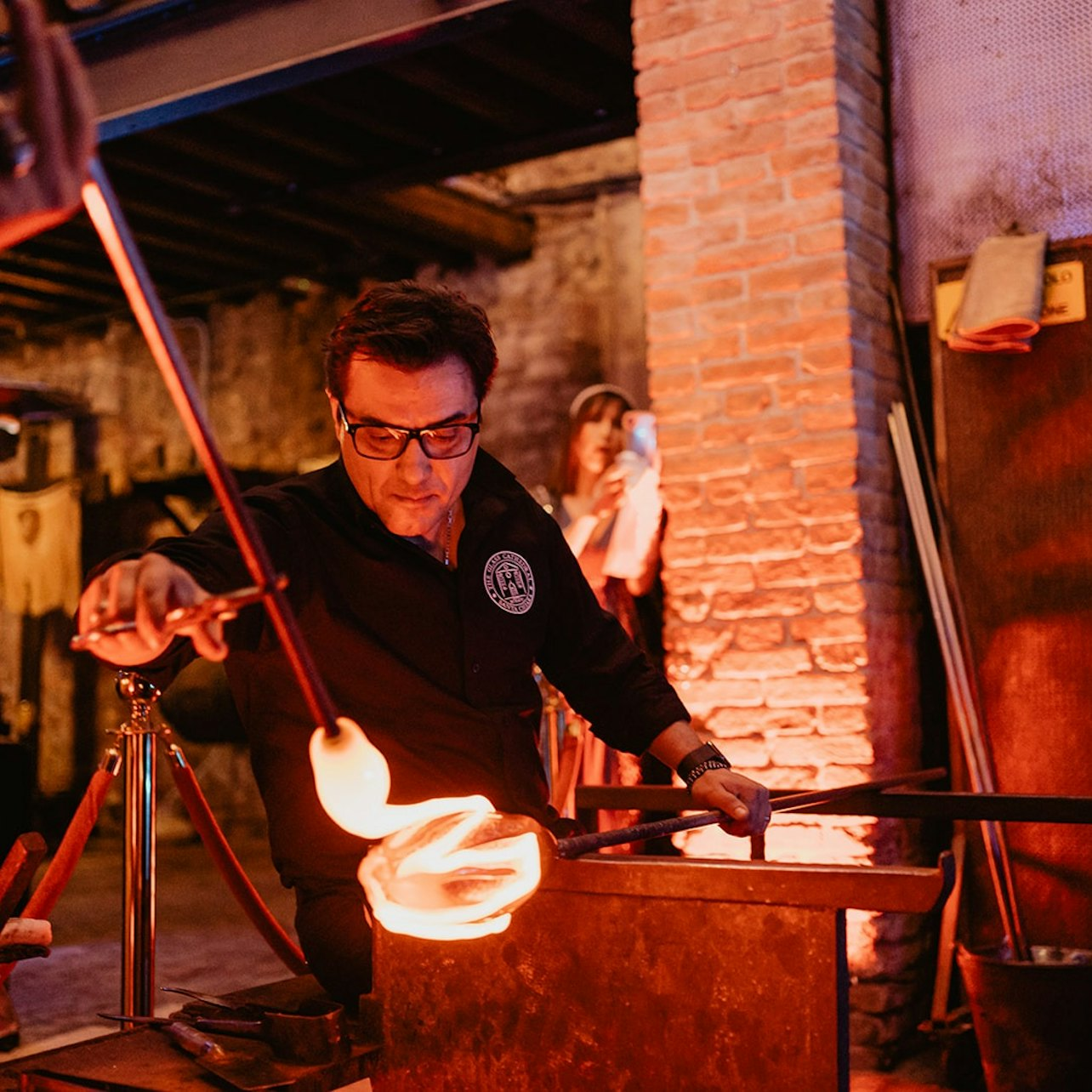 Witness the artistry of glass-blowing in the historic setting of Santa Chiara where skilled artisans transform molten glass into works of art offering a true glimpse into Murano's creative heritage.
