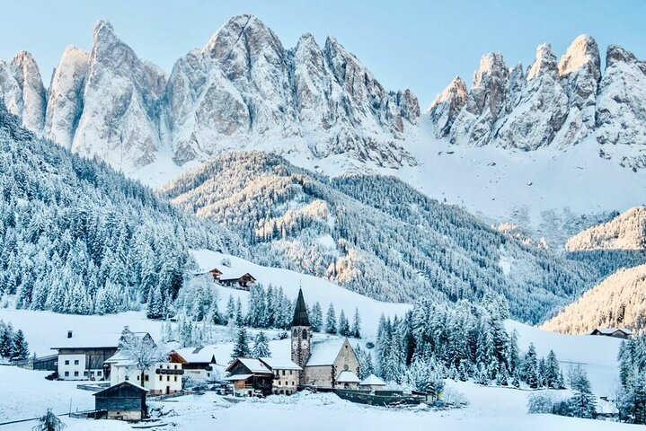 Discover the serene beauty of snow-covered peaks and quaint villages in the Dolomites. Experience nature's artistry in this UNESCO World Heritage Site perfect for adventurous souls seeking tranquility.