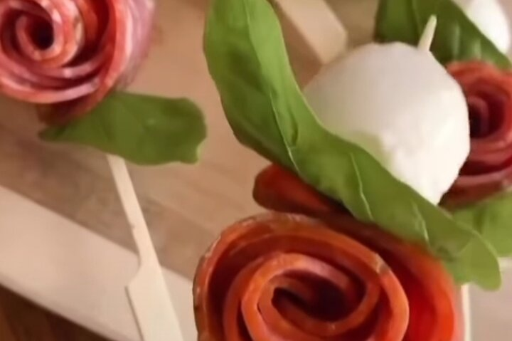 Aperitif of salami roses and mozzarella cherries