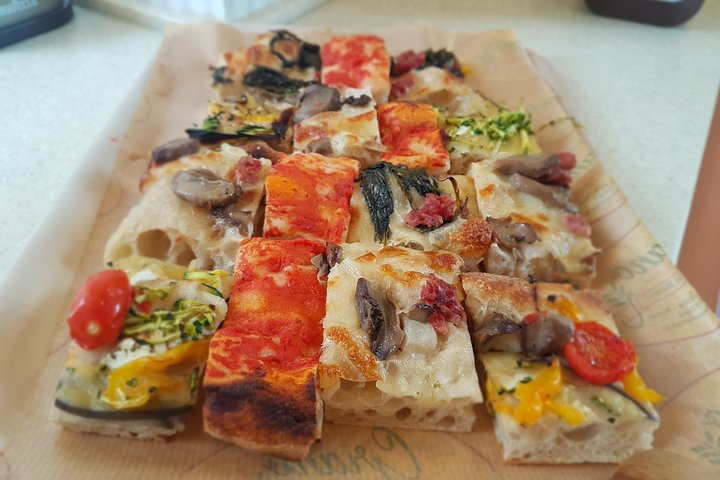 'Pizza alla pala' and 'pizza alla teglia' are 2 Roman pizzas that locals eat on the go.