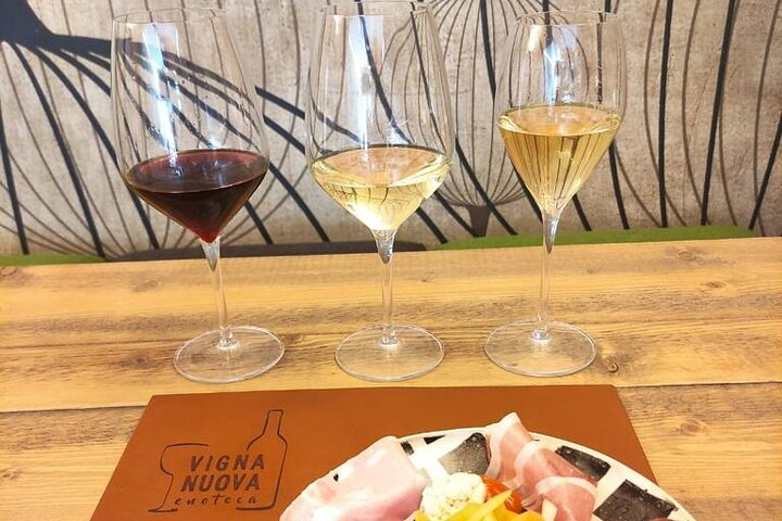 Savor the rich flavors of five unique wines perfectly paired with local delicacies while soaking in the warm ambiance of Florence's charming wine scene. A true delight for any wine lover.