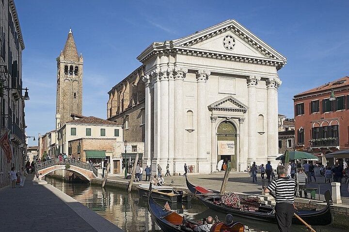 Explore the charming canals of Dorsoduro where gondolas glide past historic architecture local shops and the distinguished Ca’ Foscari University enriching your Venice experience with art and culture.