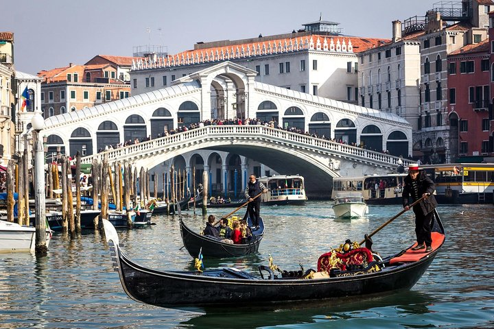 Explore the picturesque canals and historic architecture of Venice where gondolas glide by iconic landmarks and local charm invites discovery at every turn. A day filled with unforgettable experiences awaits!