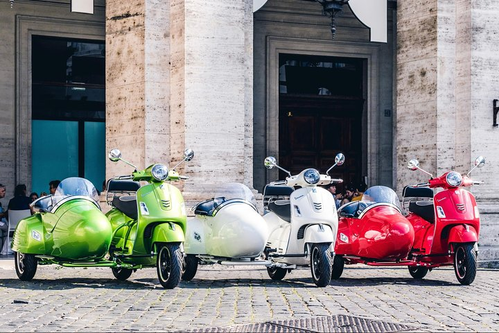 Explore Rome in style with custom-built Vespa sidecars enjoying scenic routes and rich history while savoring a delightful cappuccino. A unique way to share unforgettable moments together!
