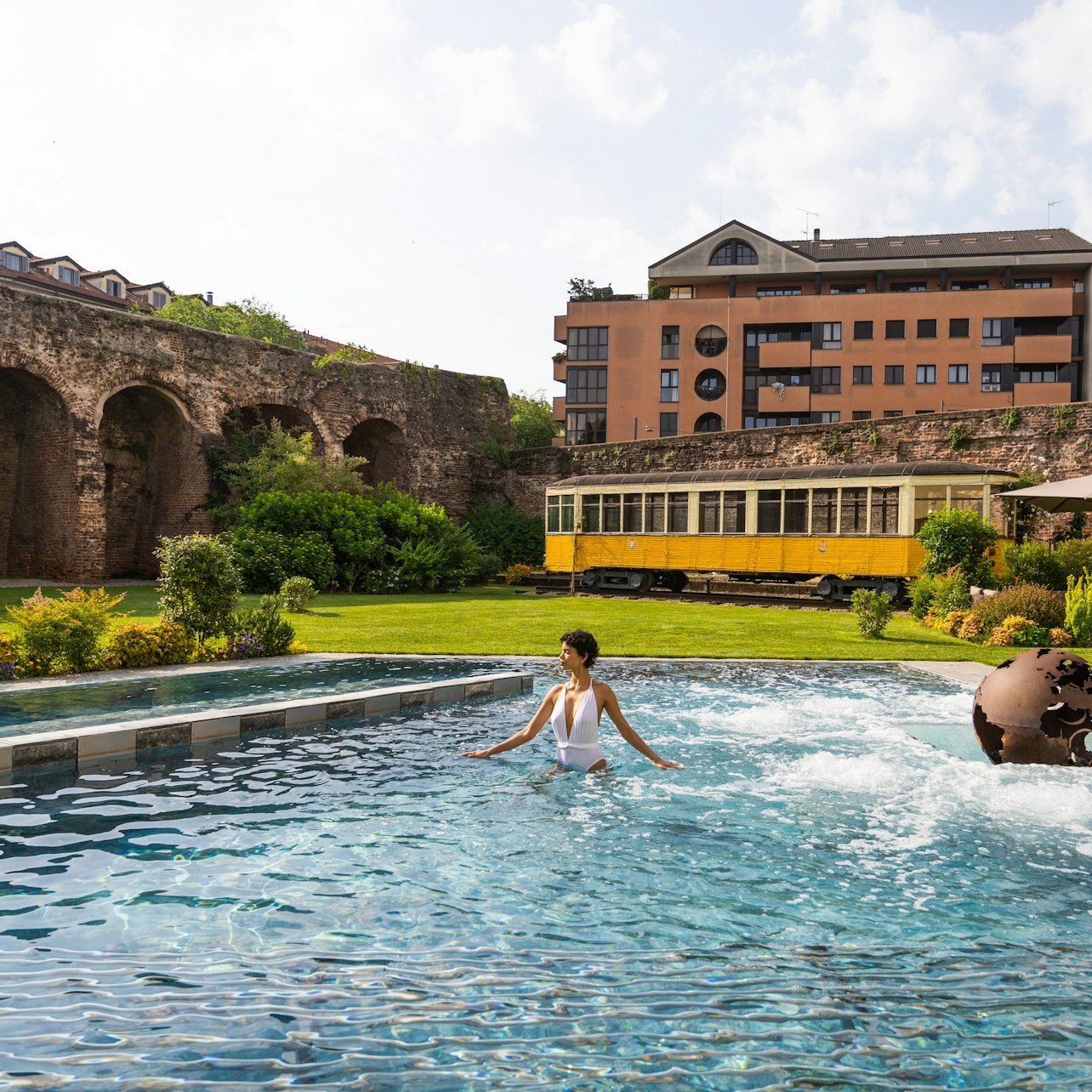 Escape the city's hustle at QC Terme Milano Spa where serene waters invite relaxation amid stunning scenery. Unwind in style with a luxurious robe and slippers provided for your spa day.