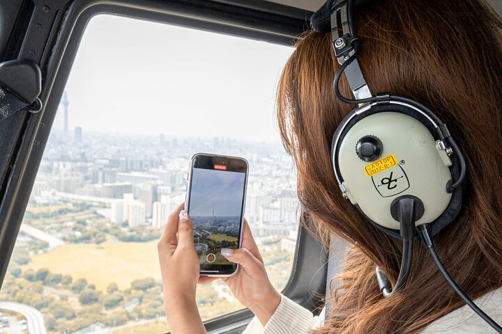 Experience the breathtaking sights of Tokyo from above capturing stunning views while enjoying a memorable helicopter flight with family. Perfect for making lasting memories in the sky.
