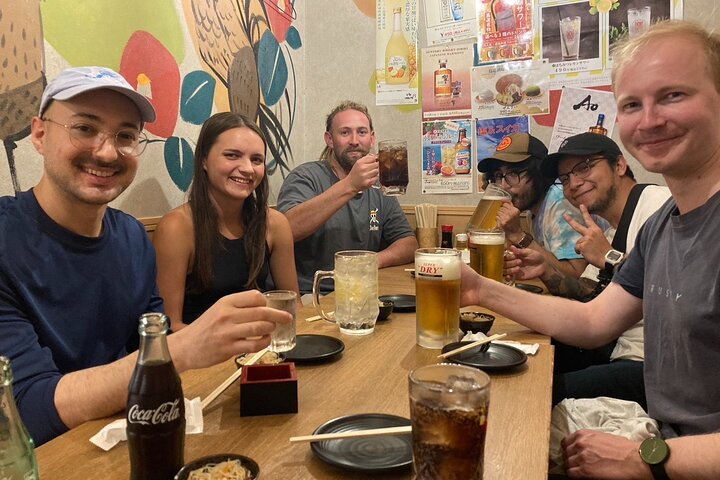 Experience authentic Japanese flavors in a cozy setting while learning about sake traditions. Engage with local delicacies and share laughter with fellow travelers on this unique culinary journey.