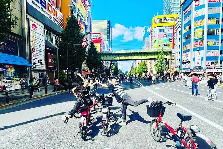 Explore the iconic streets of Chiyoda on an electric bike soaking in the blend of historic landmarks and modern surroundings all while enjoying a delightful ride with friends.