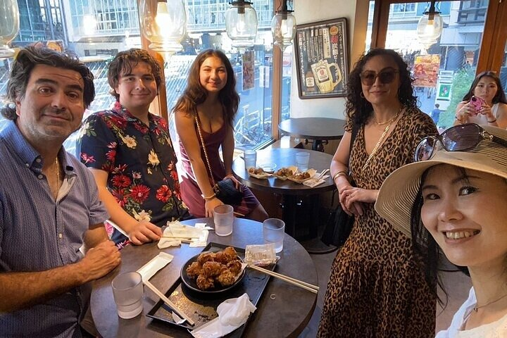 Discover the charm of Nakano as you savor delicious transitional food sharing smiles and stories with friends while exploring unique shops and delightful streets in this hidden Tokyo gem.