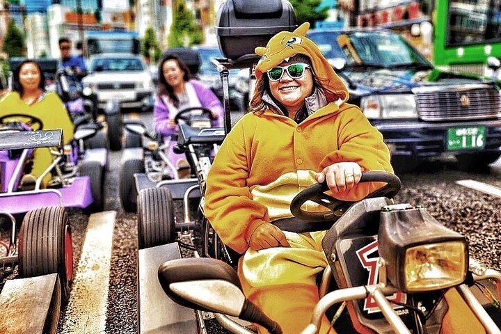 Experience the excitement of go-karting through Tokyo's iconic streets don unique costumes and capture unforgettable moments amidst the city's landmarks with a professional guide.