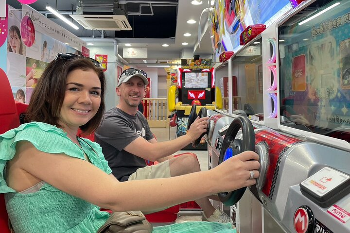 Experience the excitement of Akihabara with engaging games and unique culinary delights surrounded by colorful shops and lively characters perfect for anime and gaming enthusiasts.