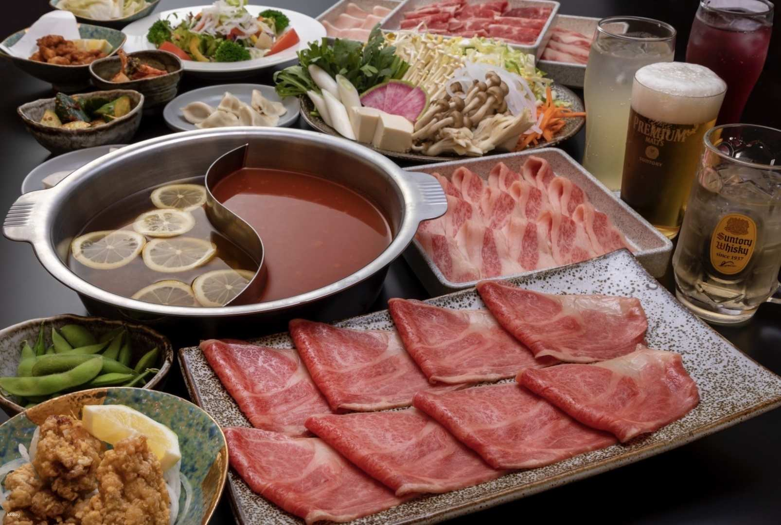 Indulge in a feast with high-quality Wagyu shabu-shabu and sukiyaki in Osaka paired with delicious sides all just steps from the iconic Ebisu Bridge.
