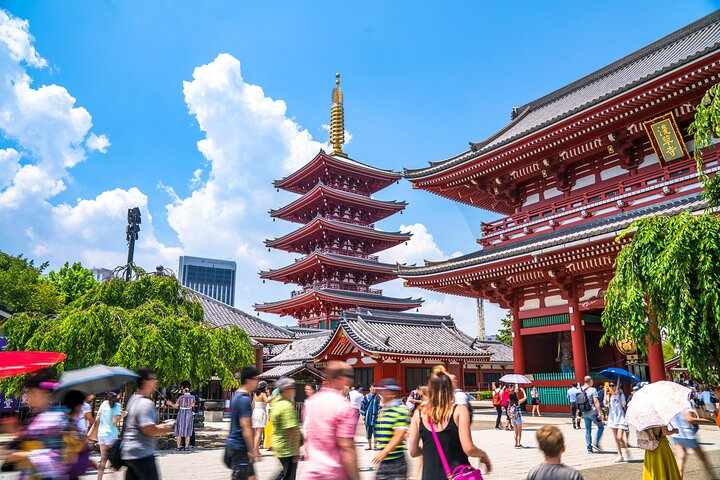 Explore the rich history of Asakusa where stunning architecture meets intriguing stories. Engage with the local culture and savor sweet snacks as you uncover Tokyo's past.