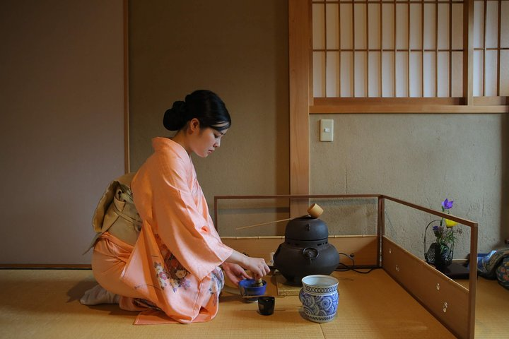 Experience the delicate art of tea preparation in a serene setting engaging with knowledgeable hosts while savoring the essence of Japanese culture amidst traditional elegance.