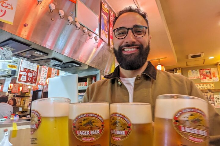 Experience the charm of Tokyo’s back streets tasting authentic dishes and enjoying local beers while uncovering hidden gems that showcase the essence of Japanese daily life.