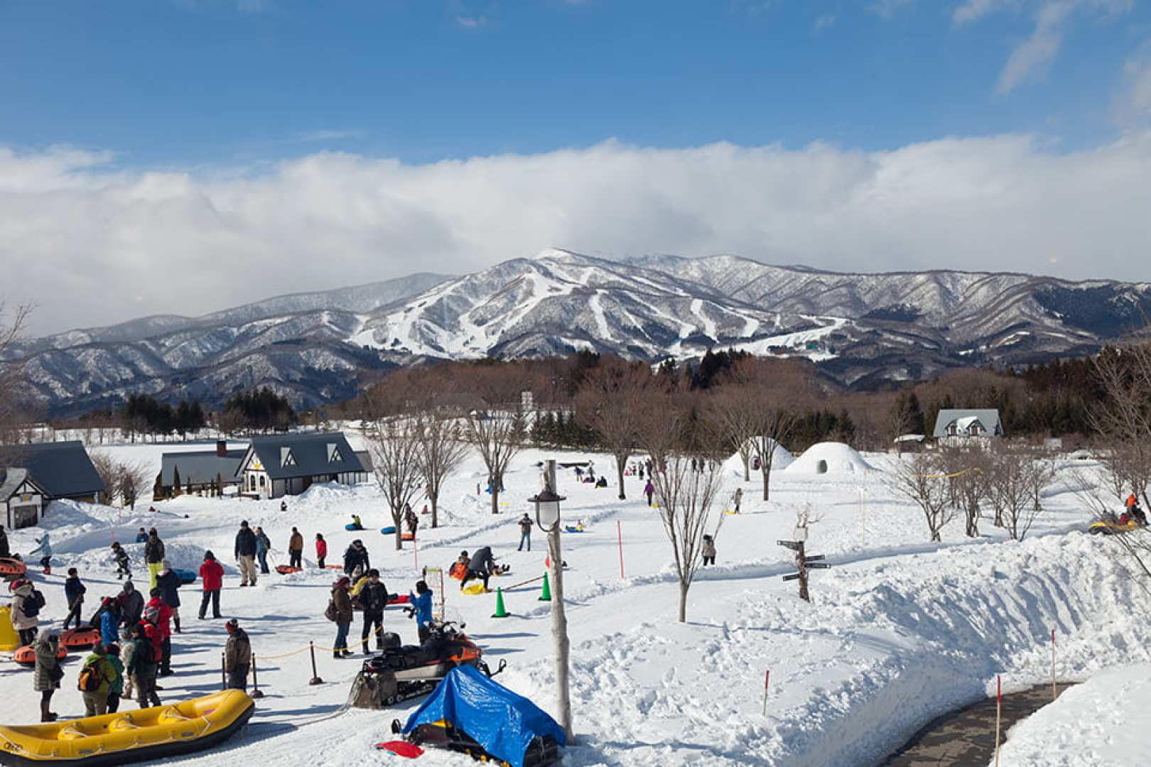 Experience a snowy wonderland at Bokka No Sato where families enjoy snow activities interact with friendly animals and unwind in soothing hot springs amidst stunning mountain views.