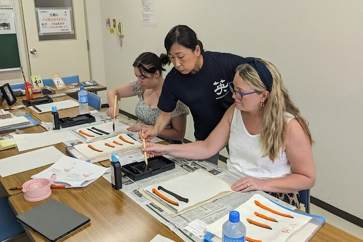 Discover the art of Japanese calligraphy while exploring Tokyo's Tsukiji and Ginza areas. Create unique displays under expert guidance making your experience memorable and personal.